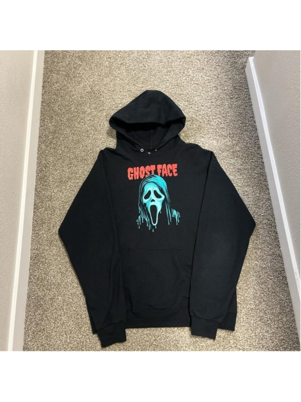 Black Ghost Face hoodie with blue ghost face graphic and red 'GHOST FACE' text #